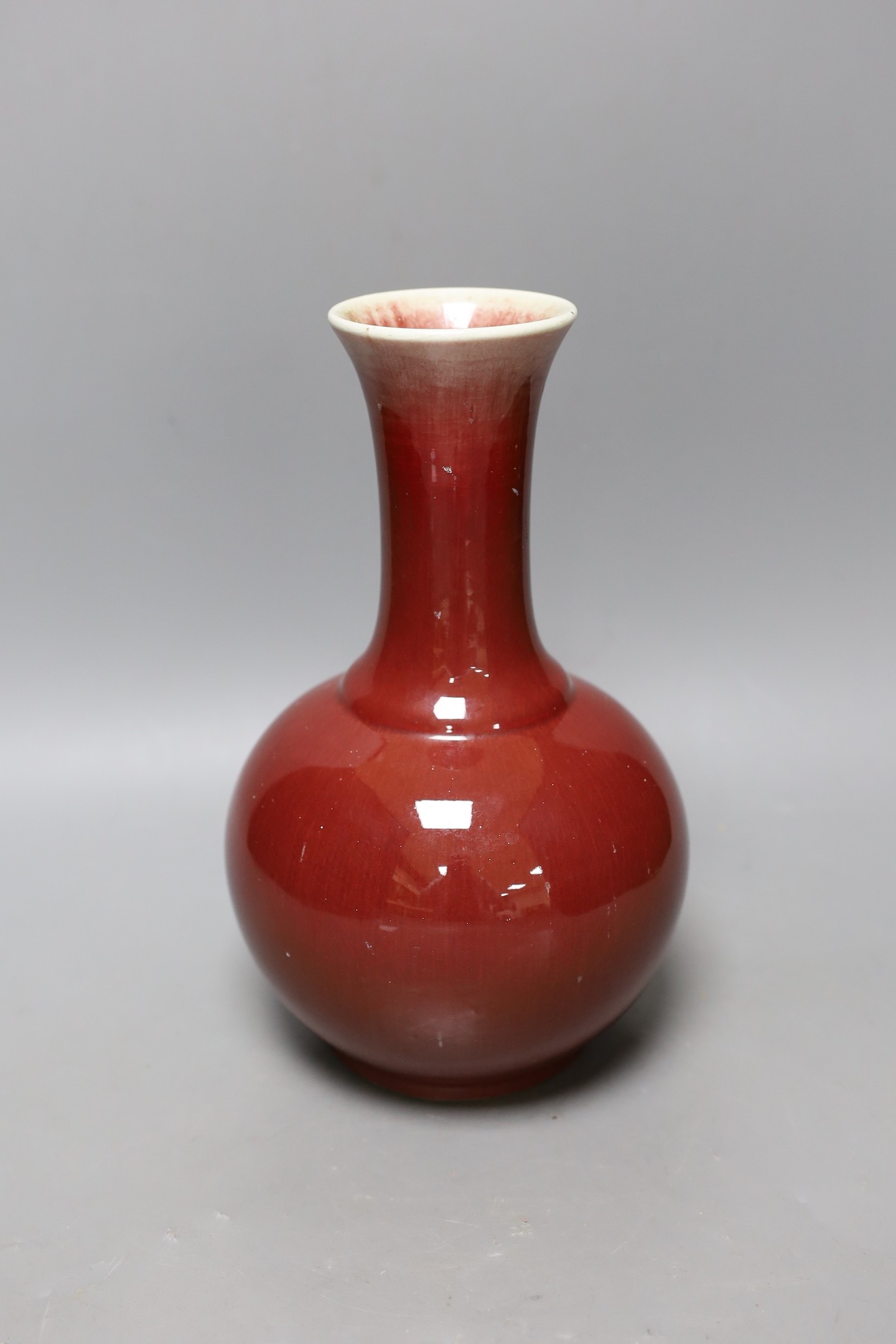 A Chinese ox blood bottle vase, mark to base 27cm